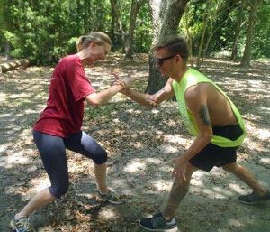Two people participating in a Serious FUN Team-Building Experience on the low course