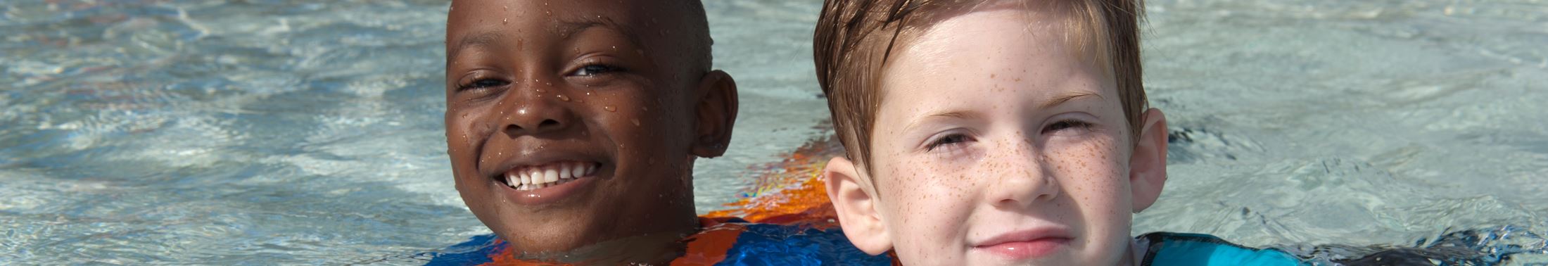 Two boys swimming