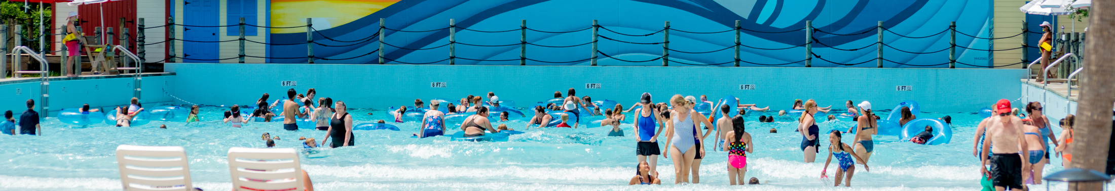 Group of people swim in the pool at Whirlin Waters Adventure Waterpark