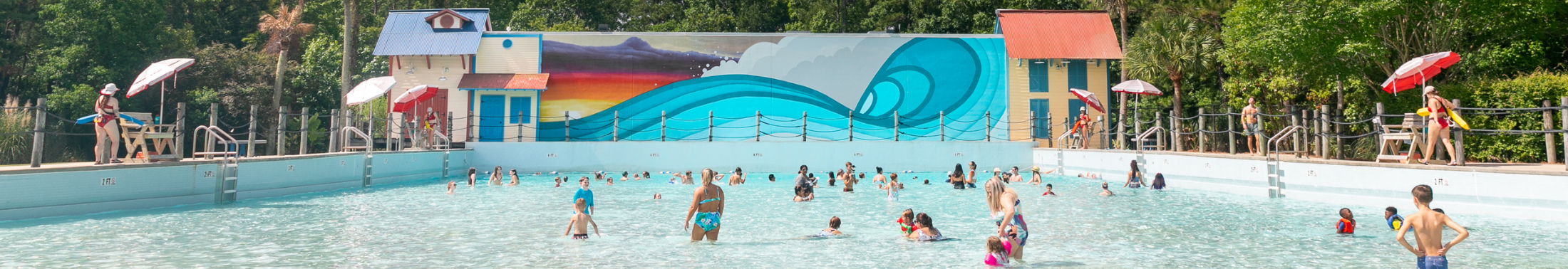 People swimming in the large wave pool at Whirlin' Waters Adventure Waterpark.