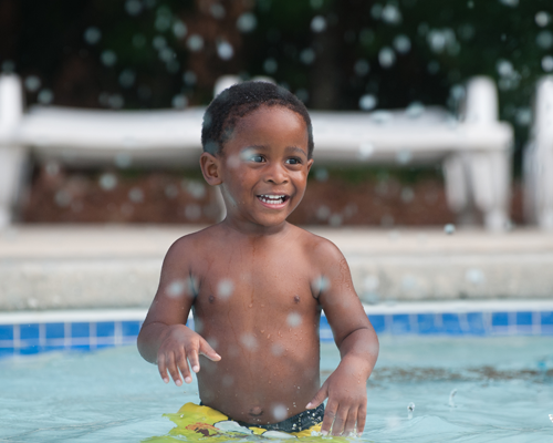 Young boy in shallow water of Lily Pad Lagoon