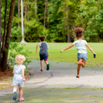 3 children play on a nature trail