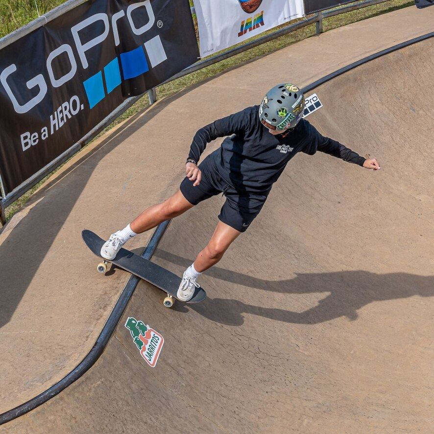 SK8 Charleston Instructor Lily Turner skateboarding in a bowl.